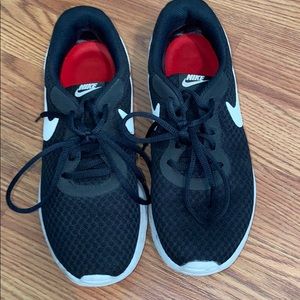 Black nike athletic shoes